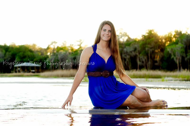 Senior Portrait girl sitting at lake