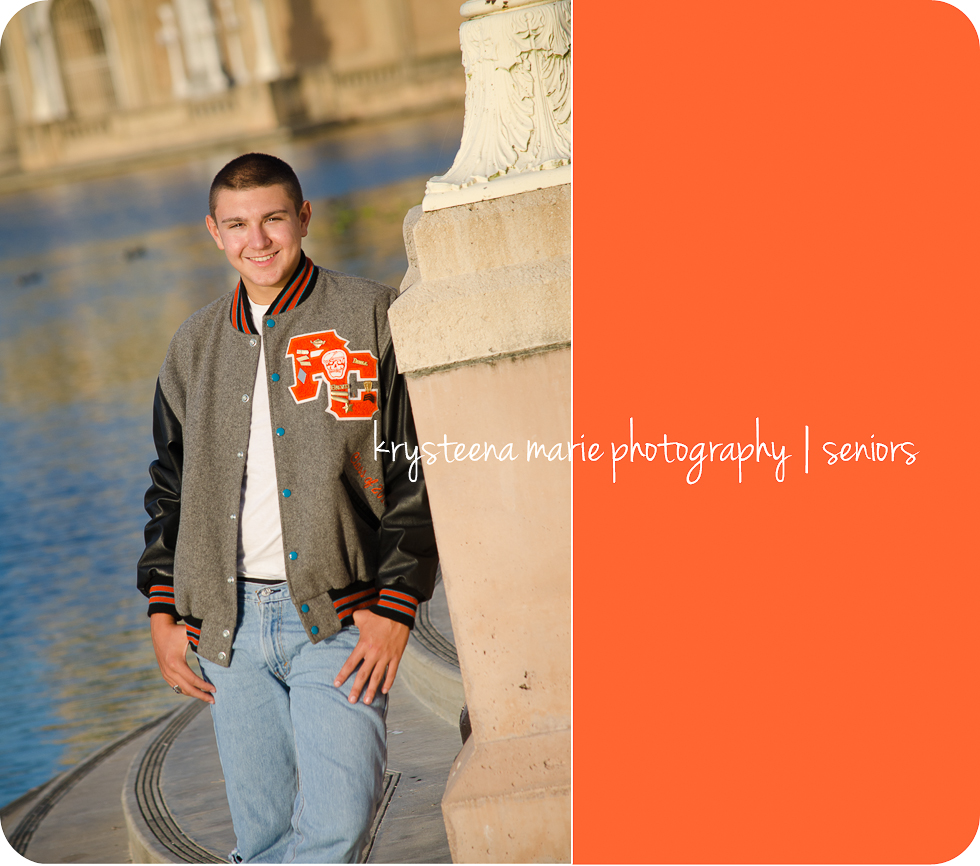 senior portrait guy in letter jacket at lake plant city