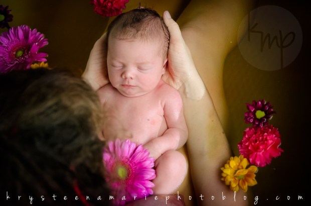 newborn session first bath herbal with flowers with mother