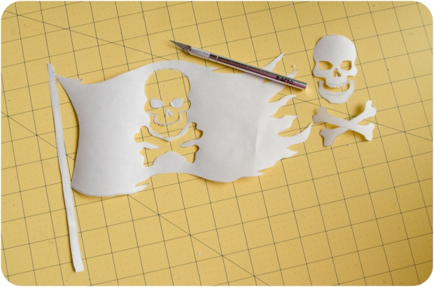 Completed freezer paper stencil jolly roger pirate flag with x-acto knife